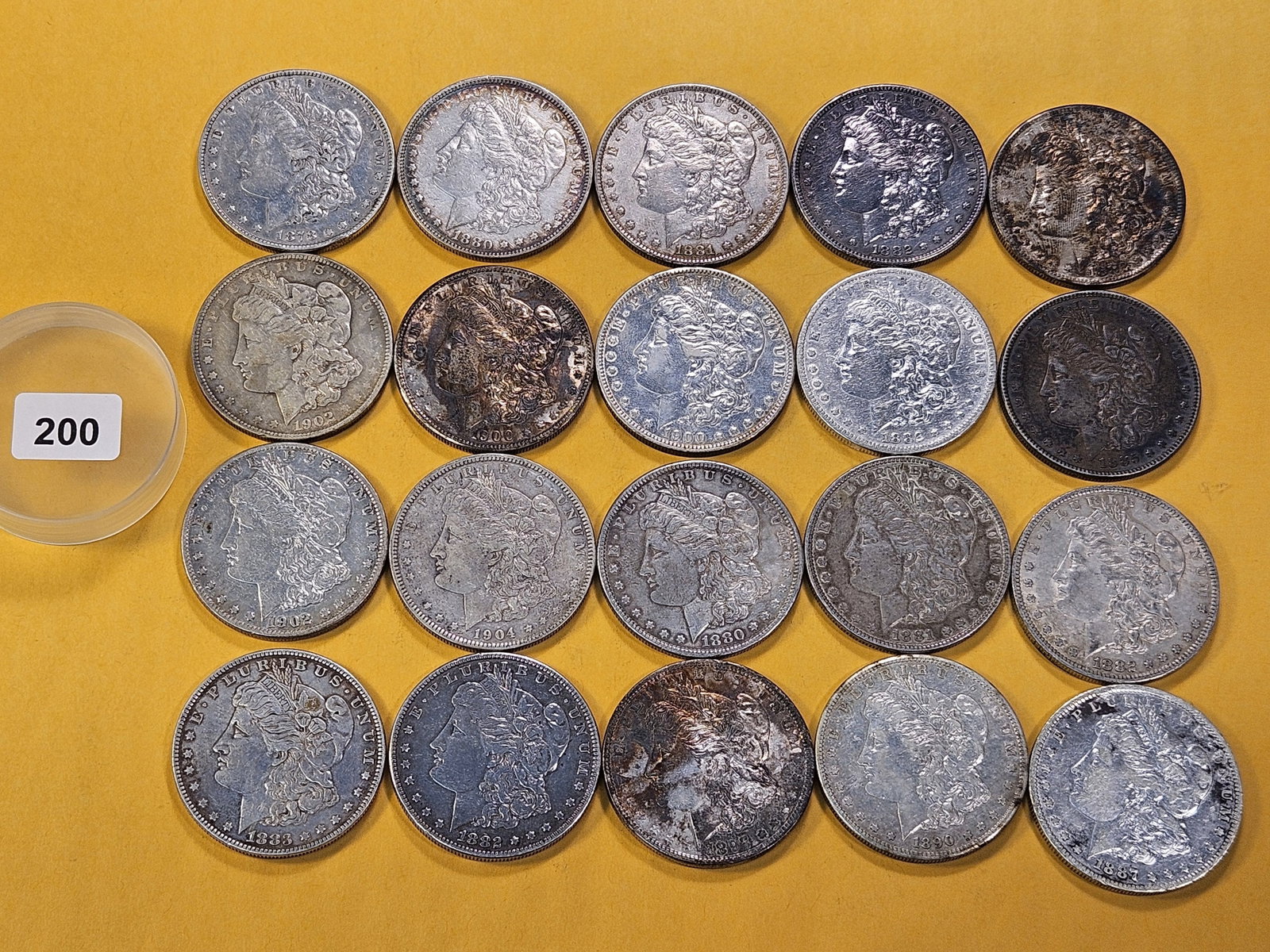 **FULL ROLL** Twenty Morgan Silver Dollars: Mixed dates all pre-1904. Mixed grades Very Good to About Uncirculated -details