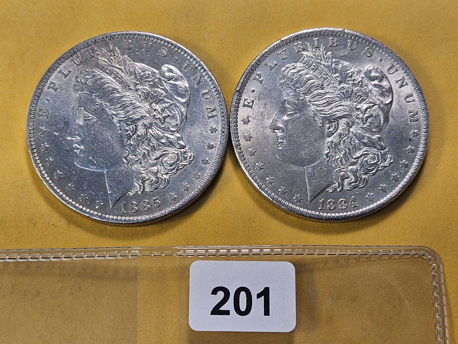 Two About Uncirculated Morgan Silver Dollar: 1884-O and 1885-O