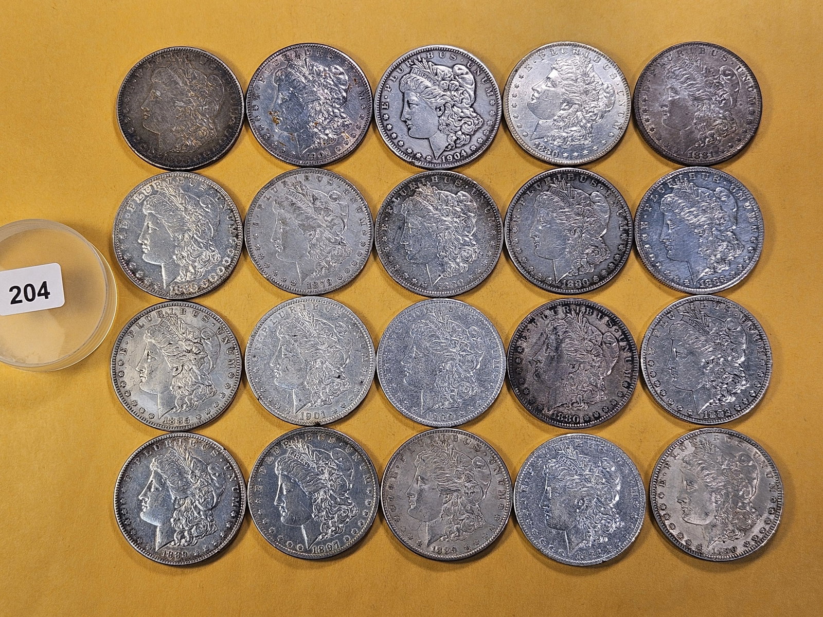 **FULL ROLL** Twenty Morgan Silver Dollars: Mixed dates all pre-1904. Mixed grades Very Good to About Uncirculated -details