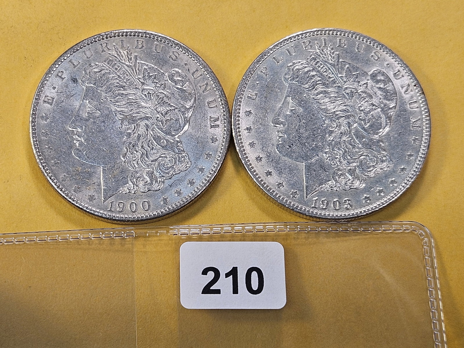 Two About Uncirculated Morgan Silver Dollar: 1900 and 1903