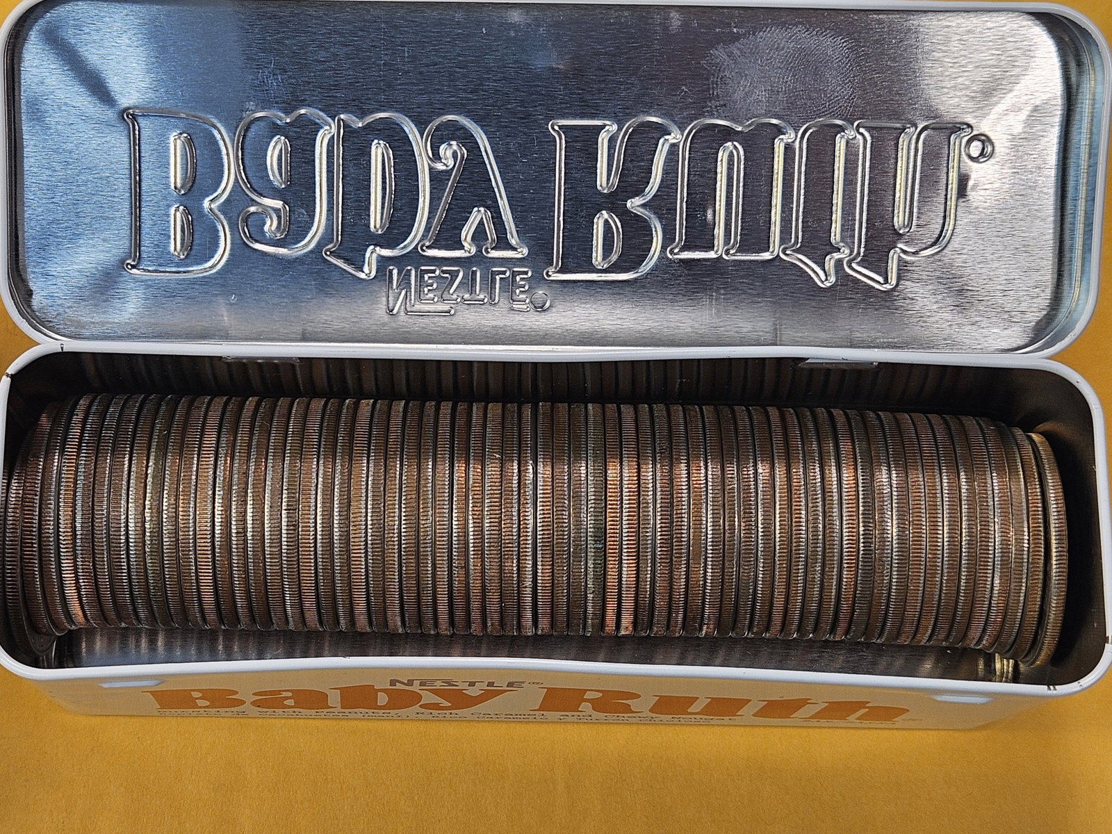 Sixty-two Eisenhower Dollars in old Baby Ruth Tin - 2