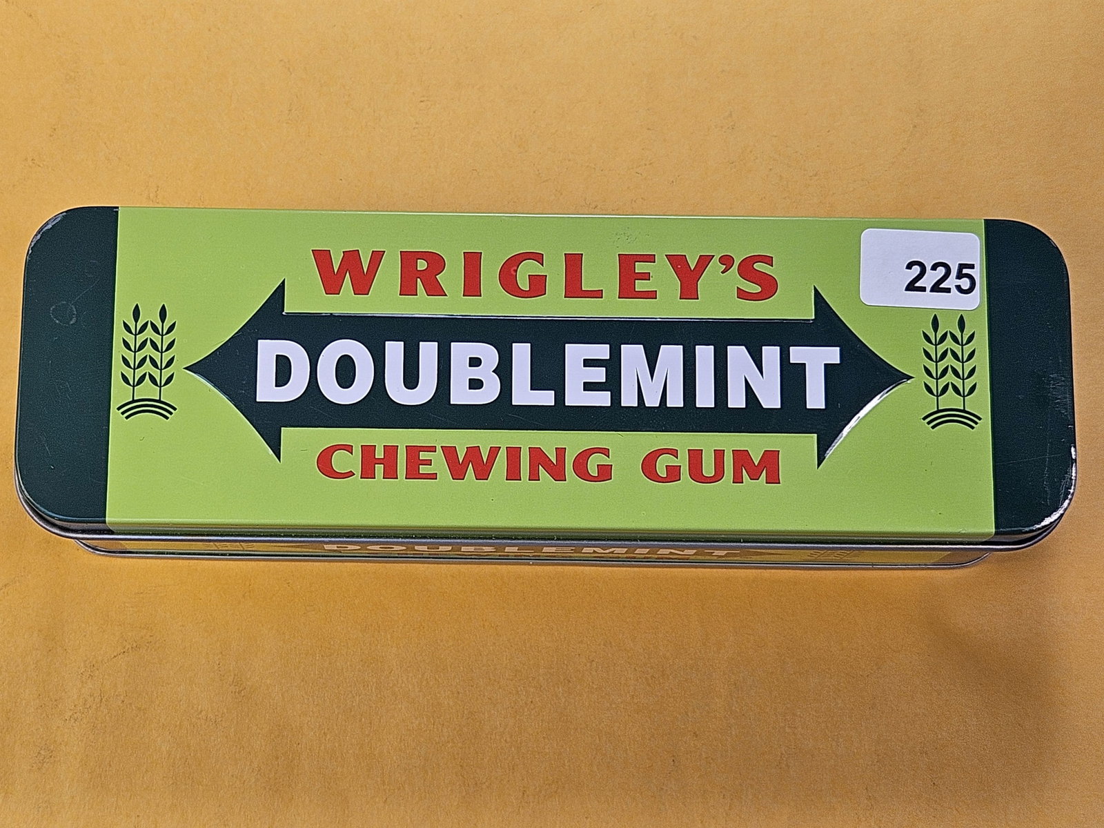 Fifty-eight Eisenhower Dollars in old Wringlys Gum Tin: Fun packaging! You’ve seen Eisenhower Dollars in Mint Packaging, how about Doublemint? Mixed dates and Grades