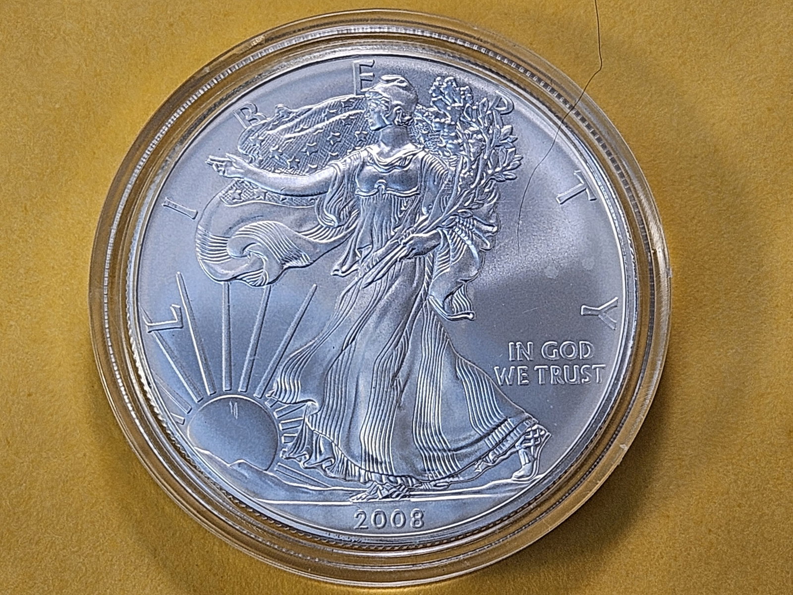 GEM Brilliant Uncirculated 2008 American Silver Eagle: Brilliant Cartwheel! In plastic capsule