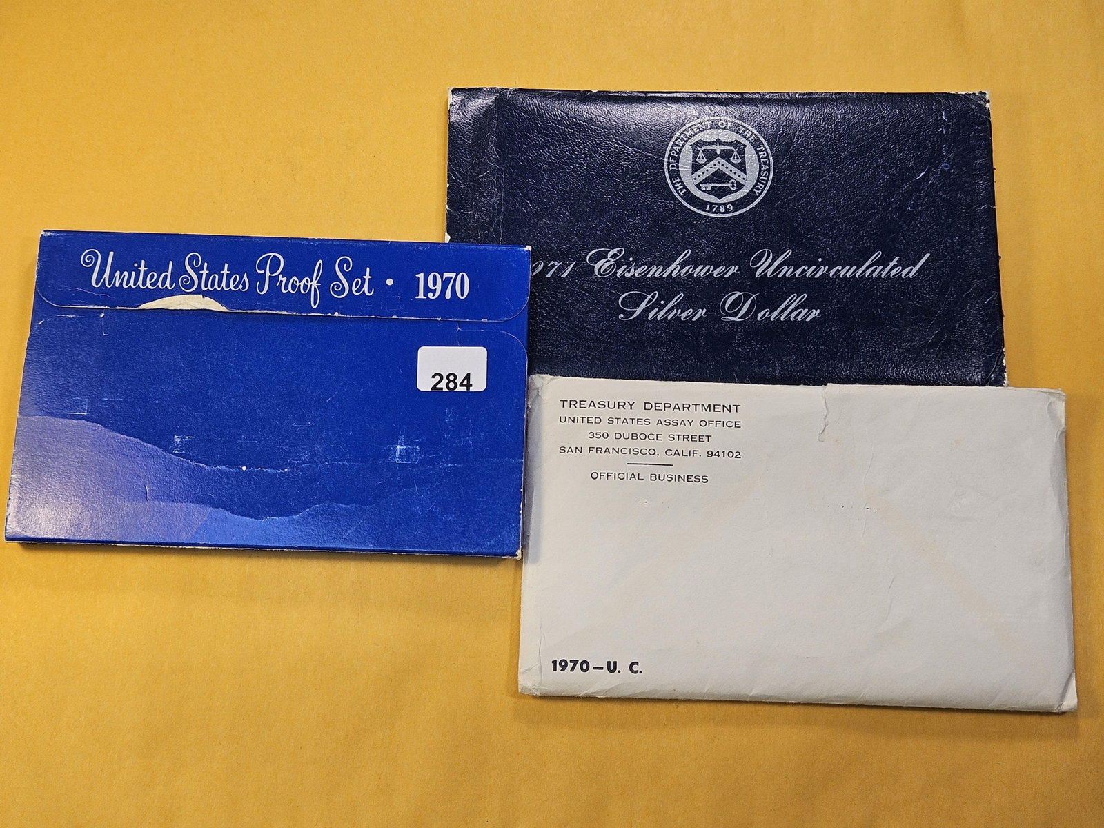 Three US Mint Silver Items: 1970 Proof Set, 1970 Uncirculated Coin Set and 1971-S Eisenhower Silver Dollar. All are in OGP with COA's