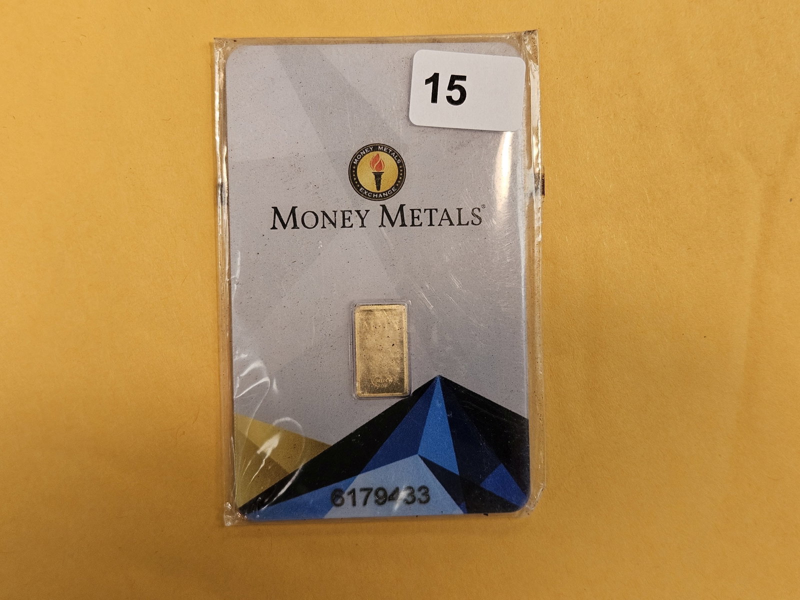 GOLD! Money Metals One-Half Gram .9999 fine gold bar: In original assay holder. Packaging is a little scuffy