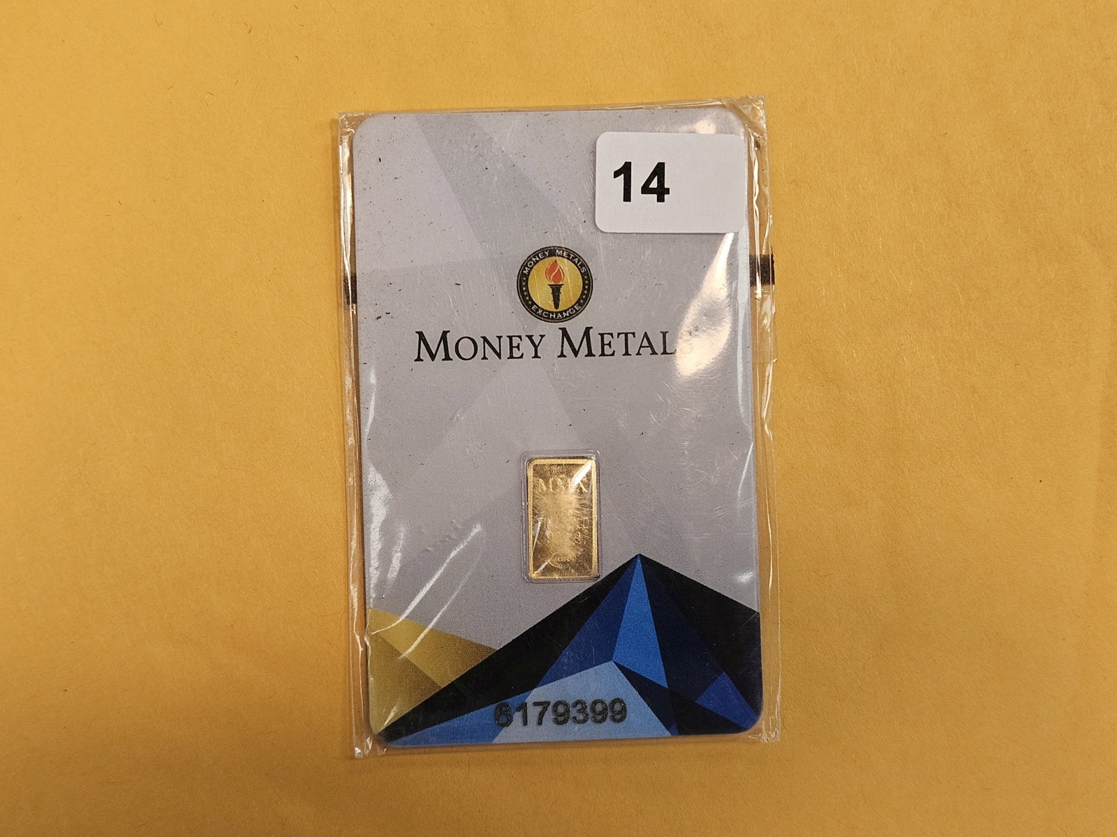 GOLD! Money Metals One-Half Gram .9999 fine gold bar: In original assay holder. Packaging is a little scuffy