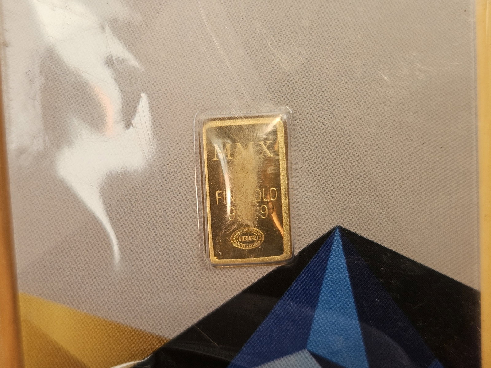 GOLD! Money Metals One-Half Gram .9999 fine gold bar: In original assay holder. Packaging is a little scuffy