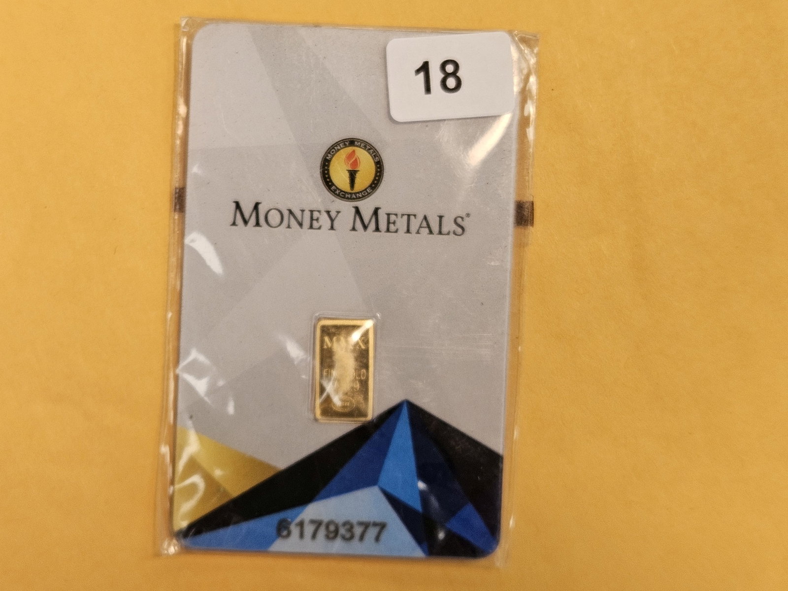 GOLD! Money Metals One-Half Gram .9999 fine gold bar: In original assay holder. Packaging is a little scuffy