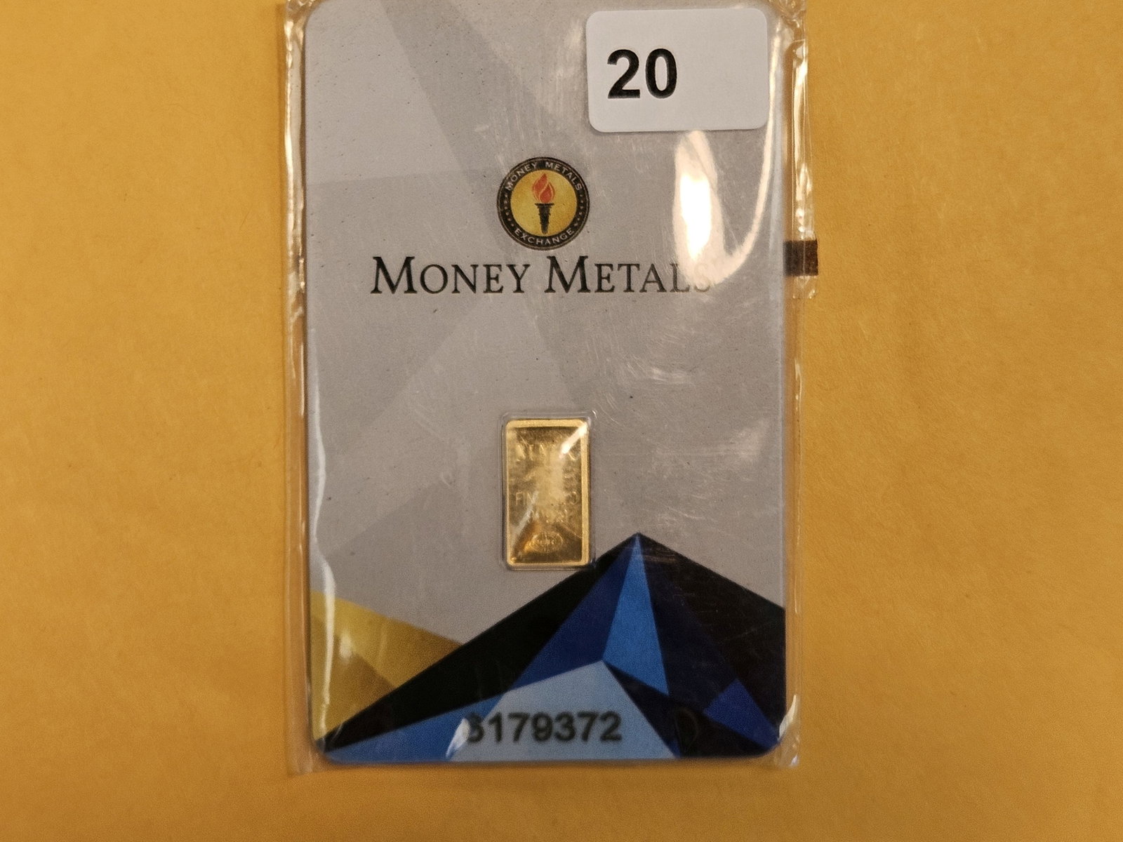GOLD! Money Metals One-Half Gram .9999 fine gold bar: In original assay holder. Packaging is a little scuffy