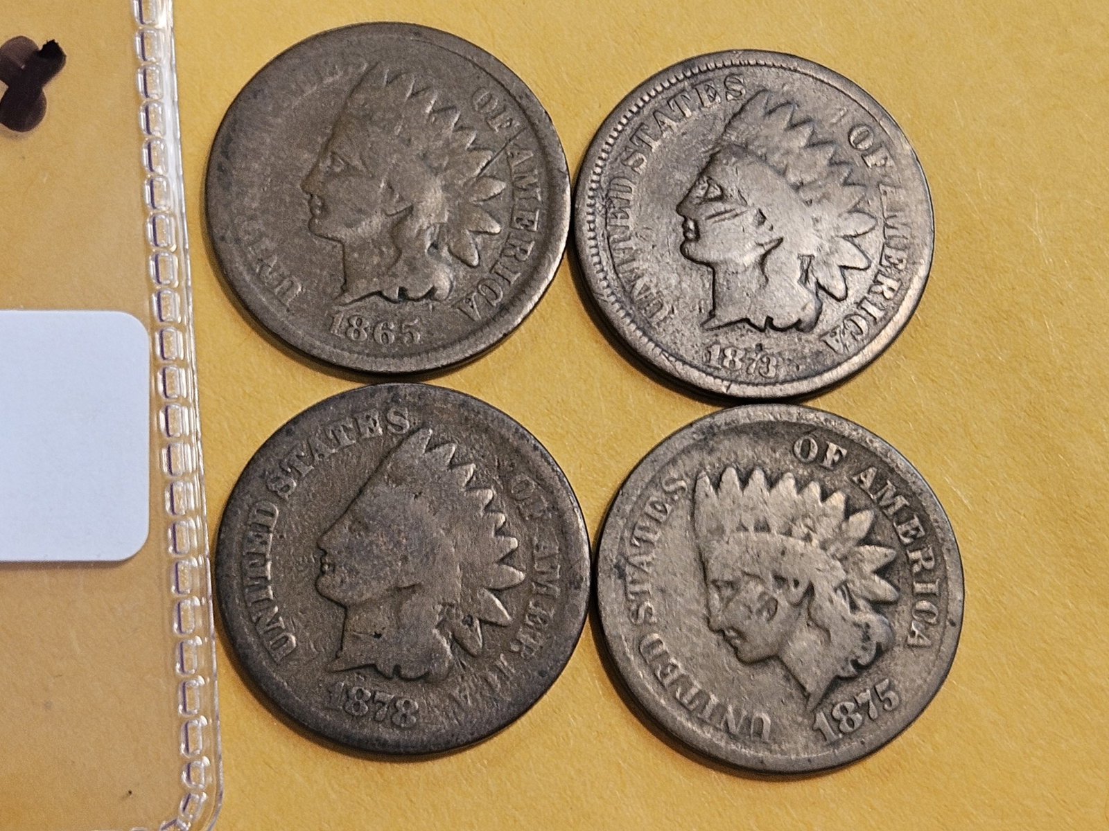 Four better date Indian Cents in Good to Very Good: 1865, 1873, 1875 and 1878