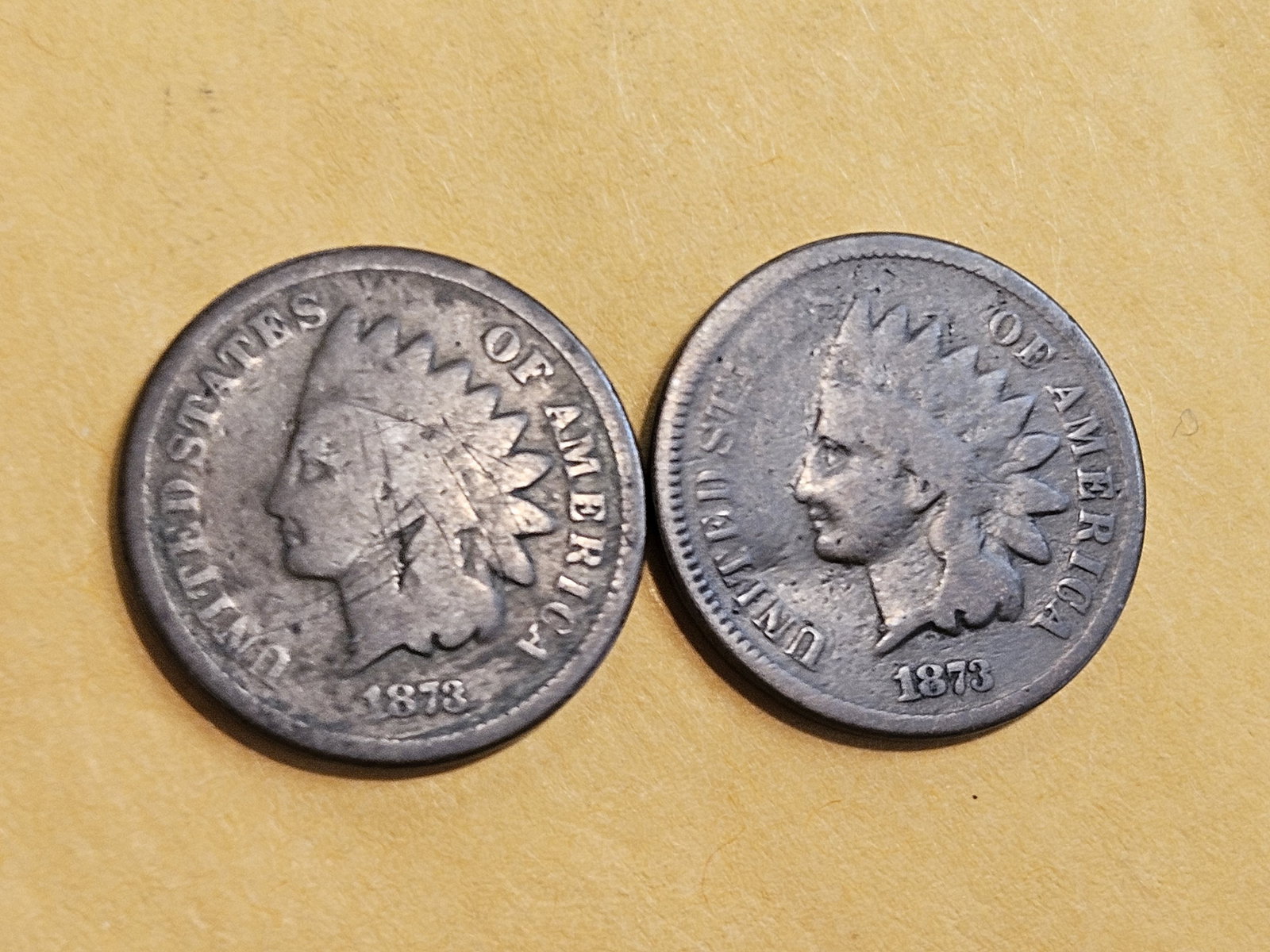 Two 1873 Indian Cent cents: Open and closed 3 versions