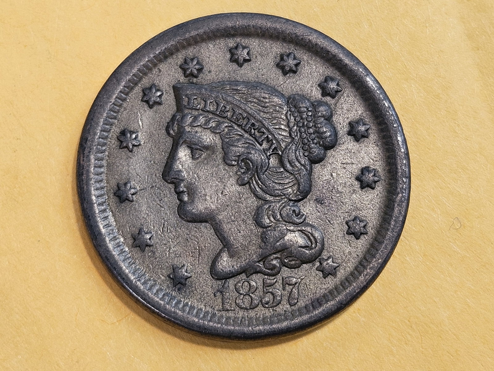 1857 Braided Hair Large Cent in About Uncirculated: Large Date version. Last year issue