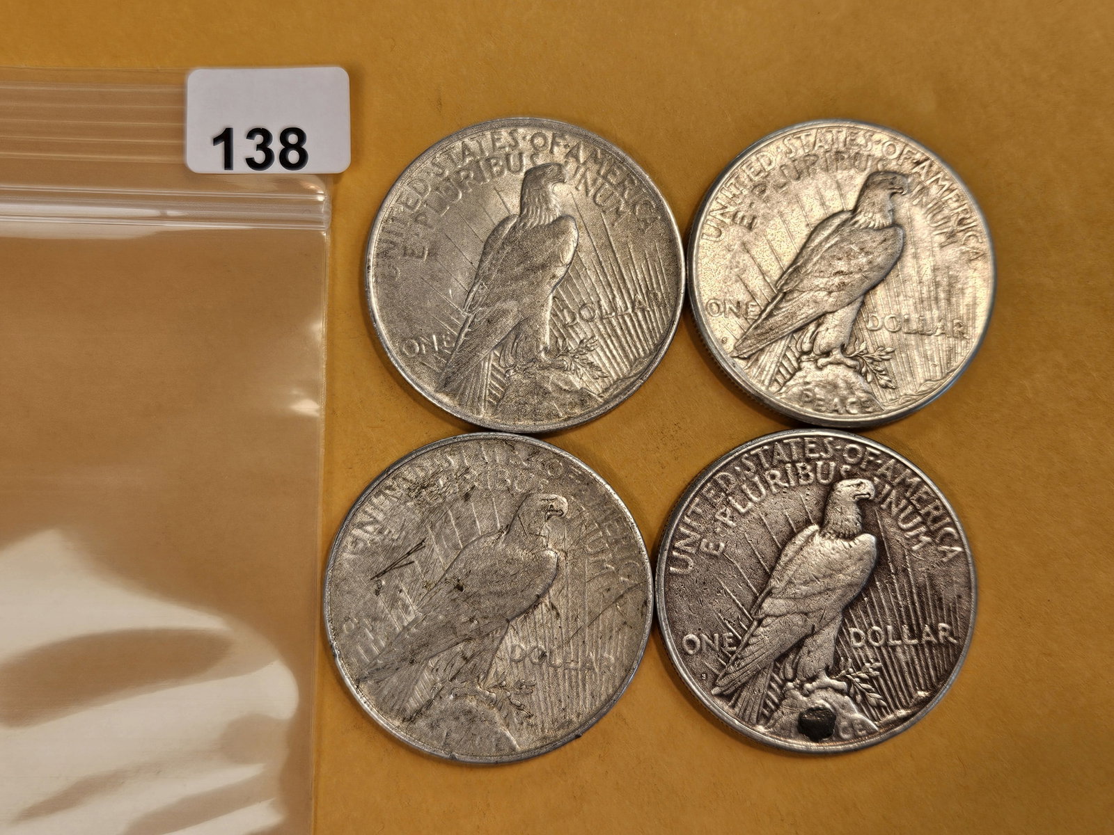 Four mixed Peace Silver Dollars - 2