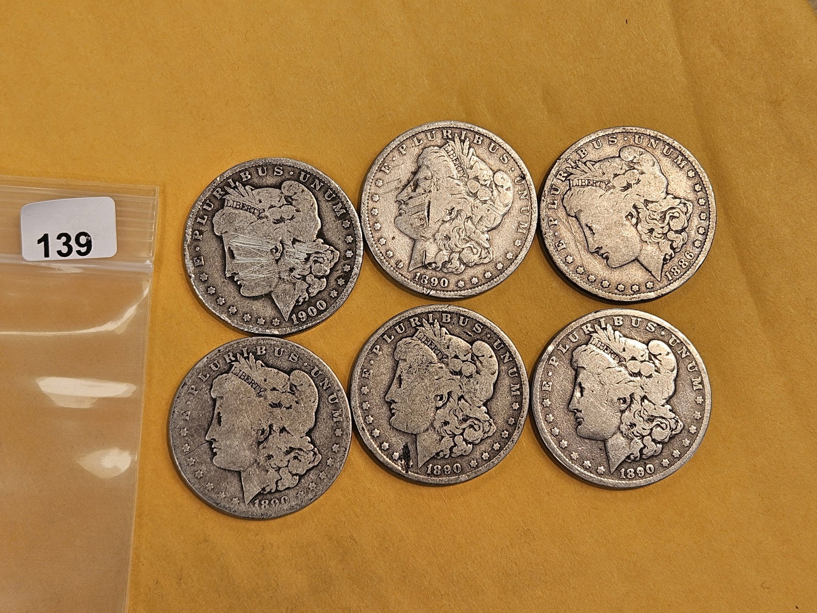 Six mixed Morgan Silver Dollars: Circulated