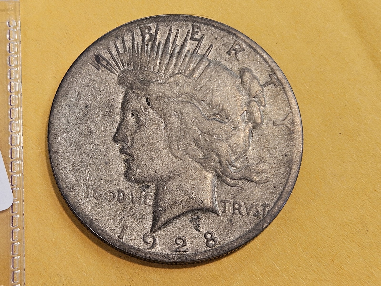* KEY DATE * 1928 Peace silver Dollar in Very Good: Light patina