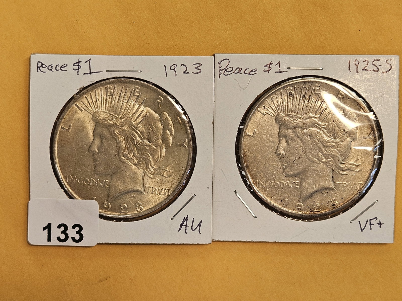 1923 and 1925-S Peace Silver Dollars: In AU and Very Fine plus