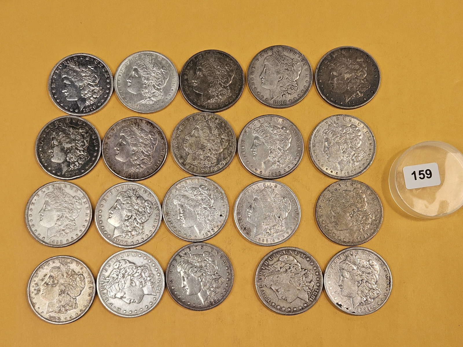 ** FULL ROLL ** Twenty Morgan Silver Dollars: All pre-1904. Grades from Very Fine through About Uncirculated plus