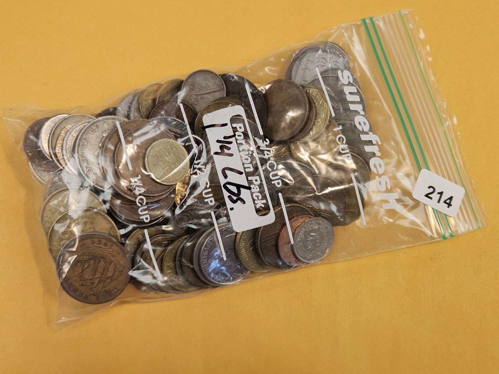 ONE and one-quarter Pound of mixed World Coins: From dealer. Unsearched by us
