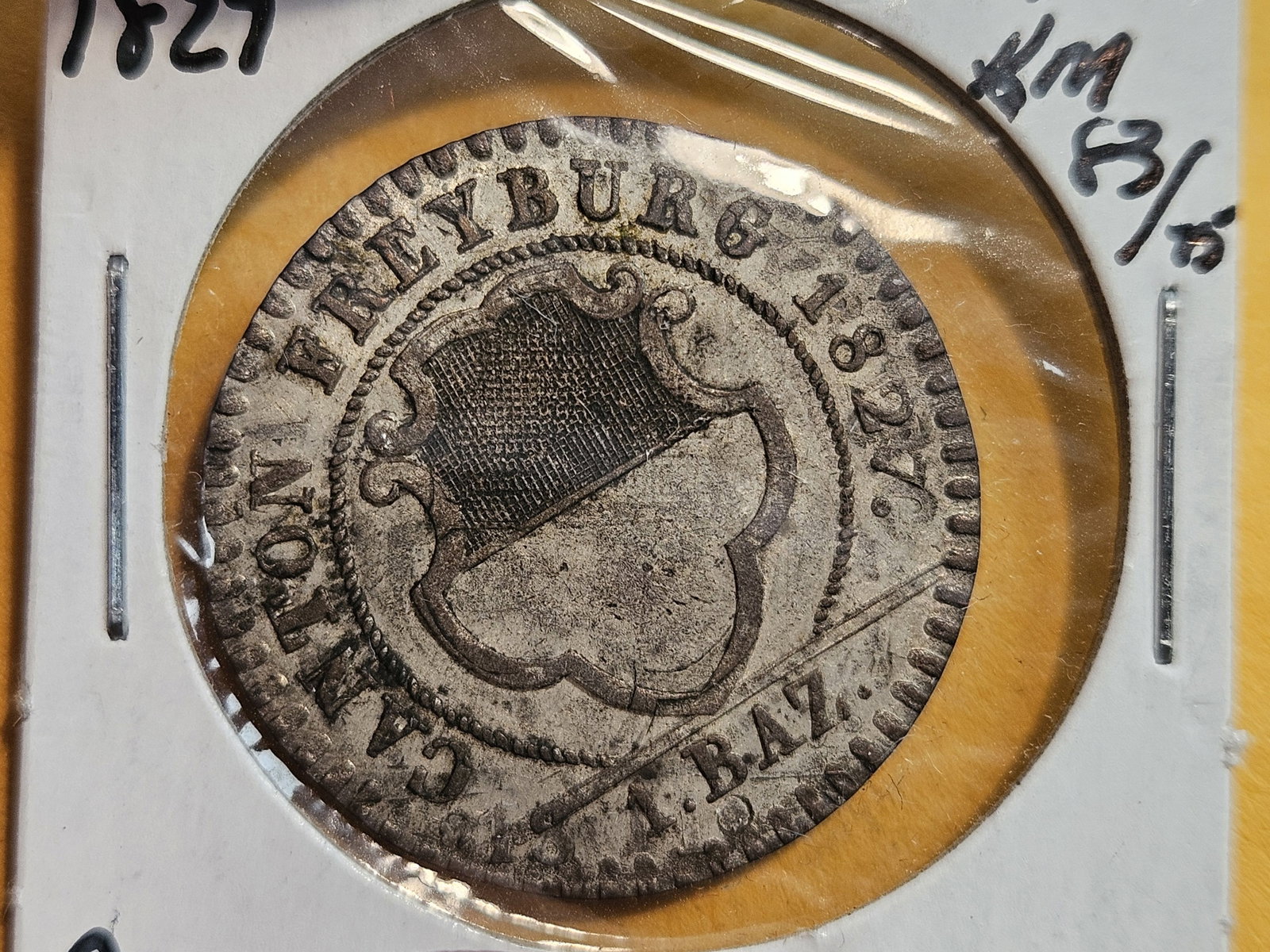 Scarcer 1827 Switzerland 1 baz Freiburg: KM 83. Struck over a 1811. Grades between XF plus and About Uncirculated