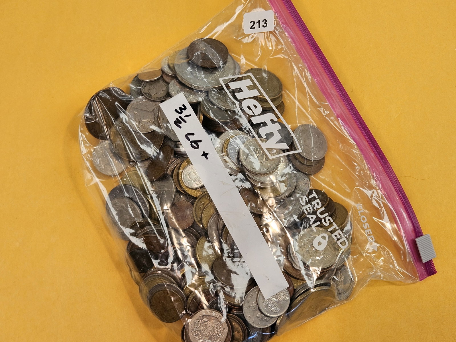 THREE and one-half Pounds of mixed World coins: From dealer. Unsearched by us