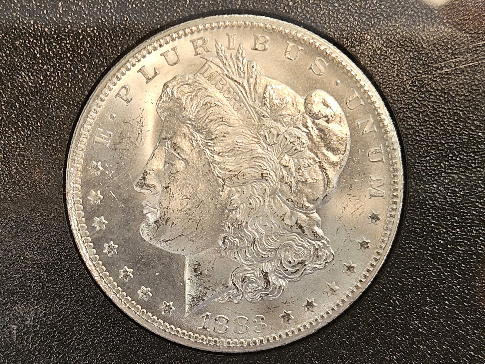 ** KEY DATE ** CACG 1883-CC Morgan Dollar in Mint State 63 - 4