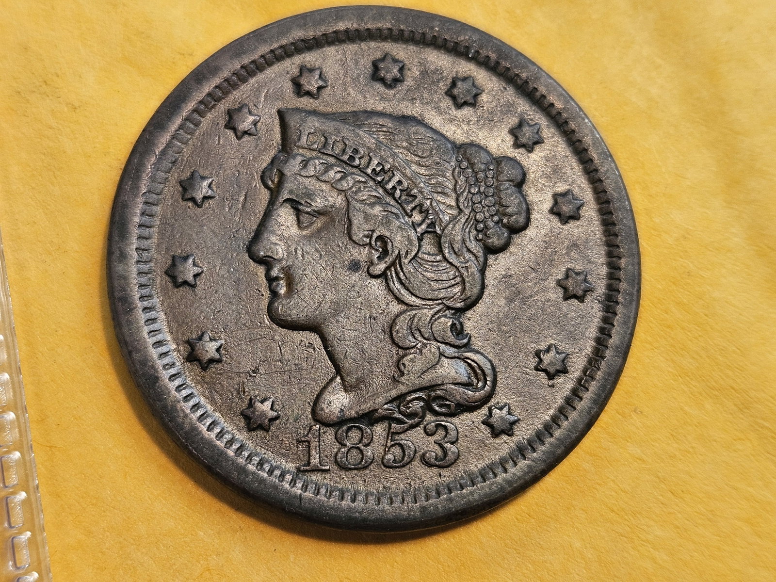 1853 Braided Hair Large Cent in Extra Fine: Hints of original luster in the protected areas