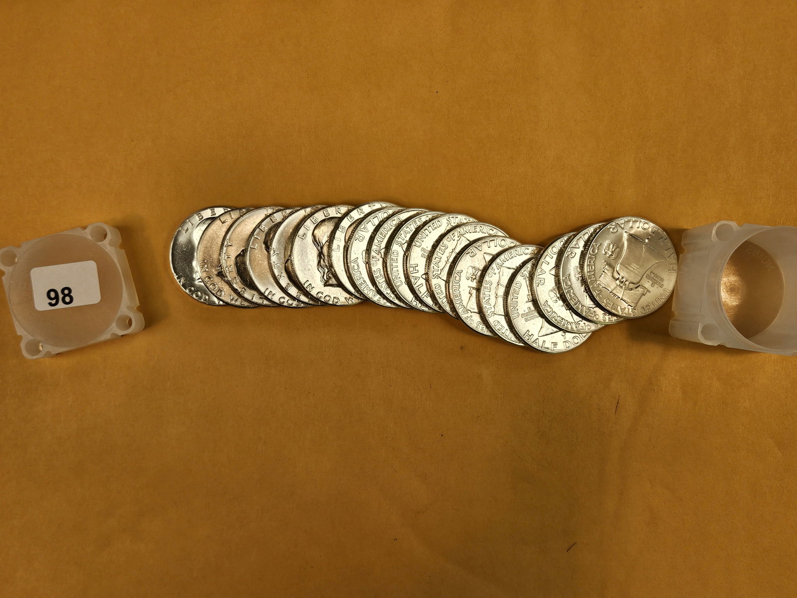Nineteen Brilliant Uncirculated silver Franklin Half Dollars: All 1963
