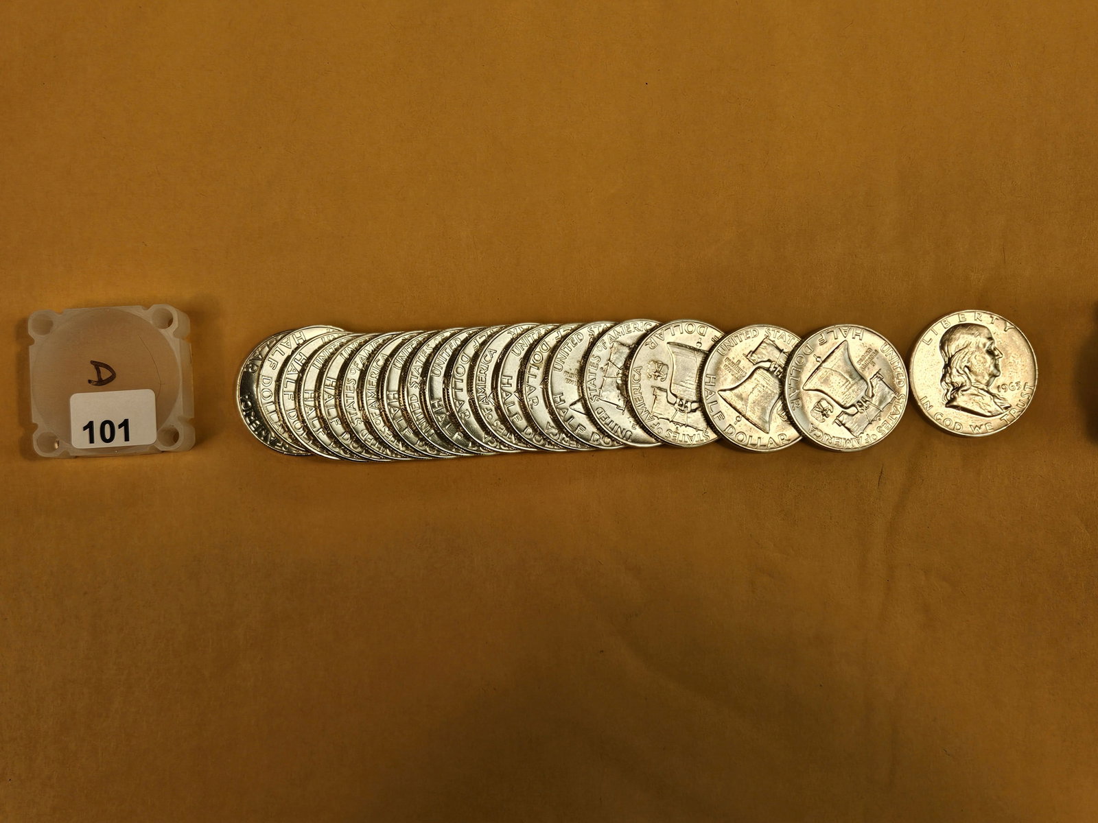 Twenty Brilliant Uncirculated silver Franklin Half Dollars: All 1963-D