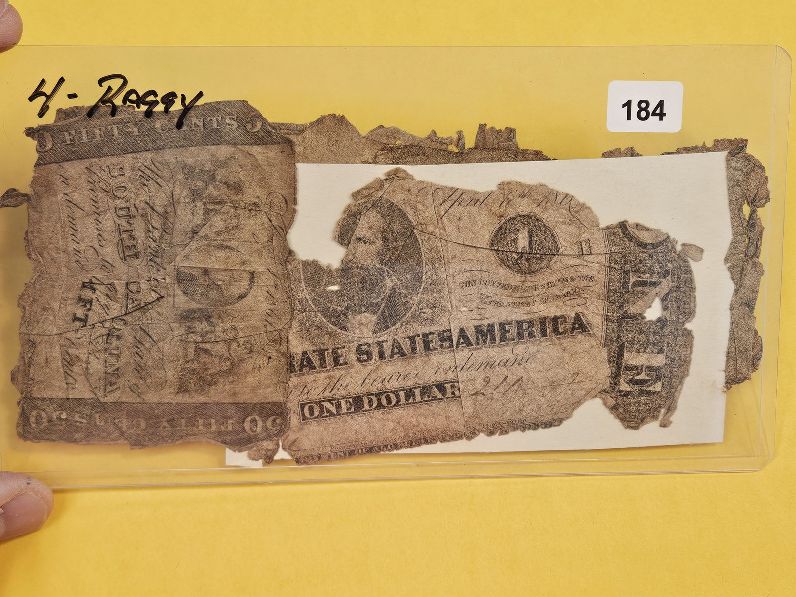 Four Raggy Confederate notes: Leaving in holder so they don't fall apart