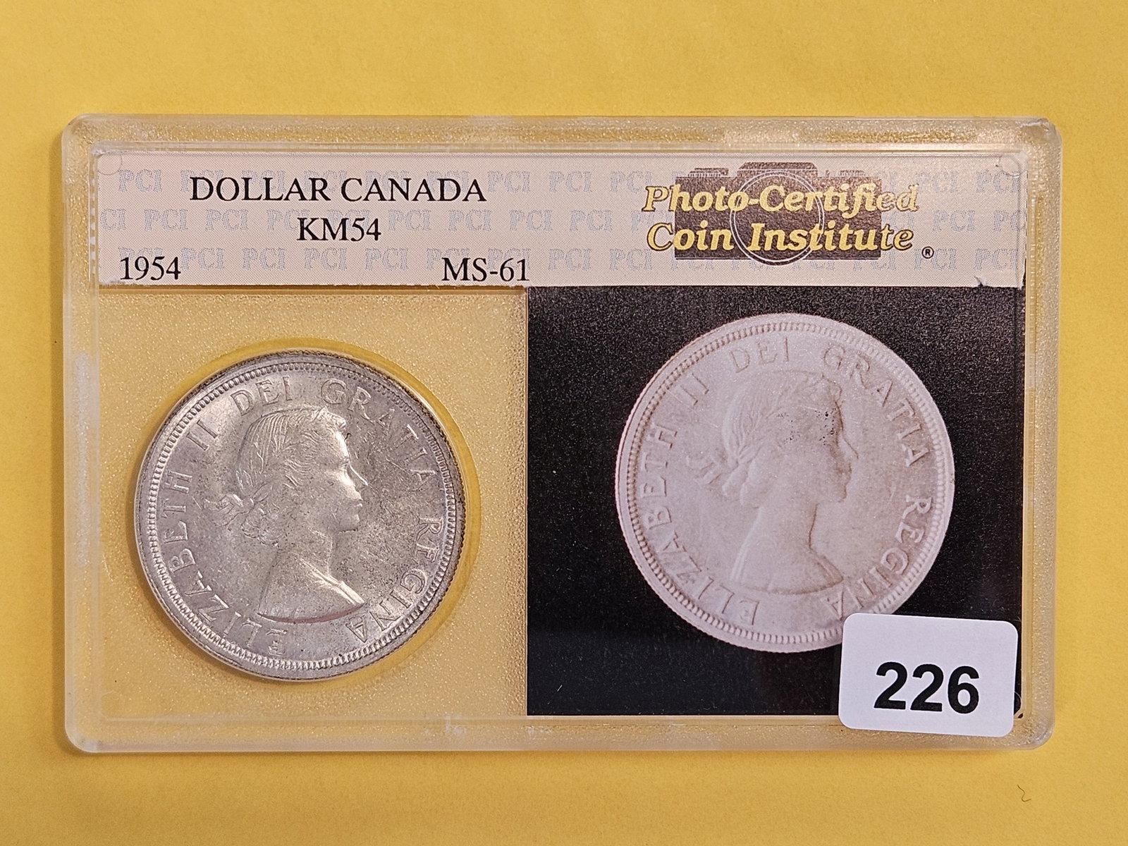 Brilliant Uncirculated 1954 Canada Silver Dollar: Graded by the Photo-Certified Coin Institute in Mint State 61. KM 54