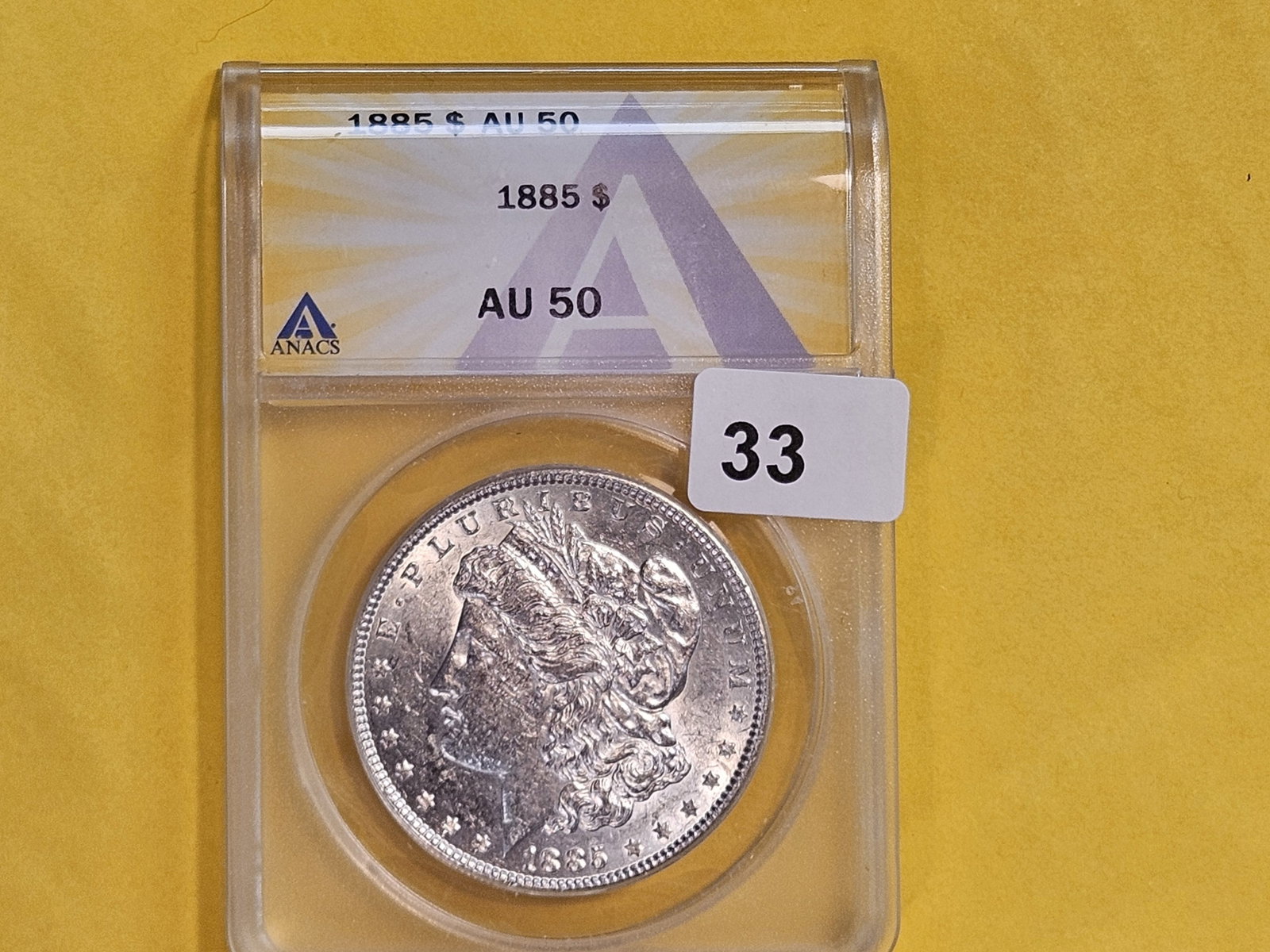 ANACS 1885 Morgan Silver Dollar in About Uncirculated - 50 - 2