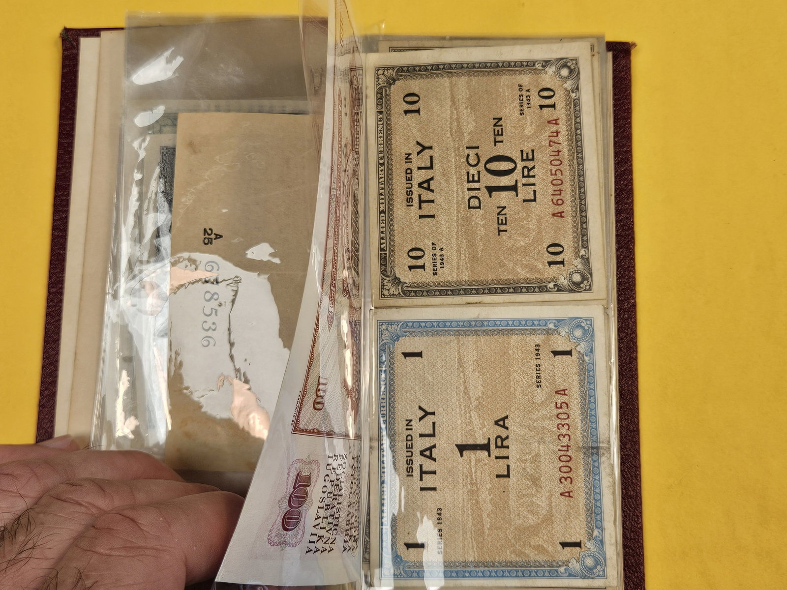 Hardcover booklet with about 40 or so pieces of World Currency - 4