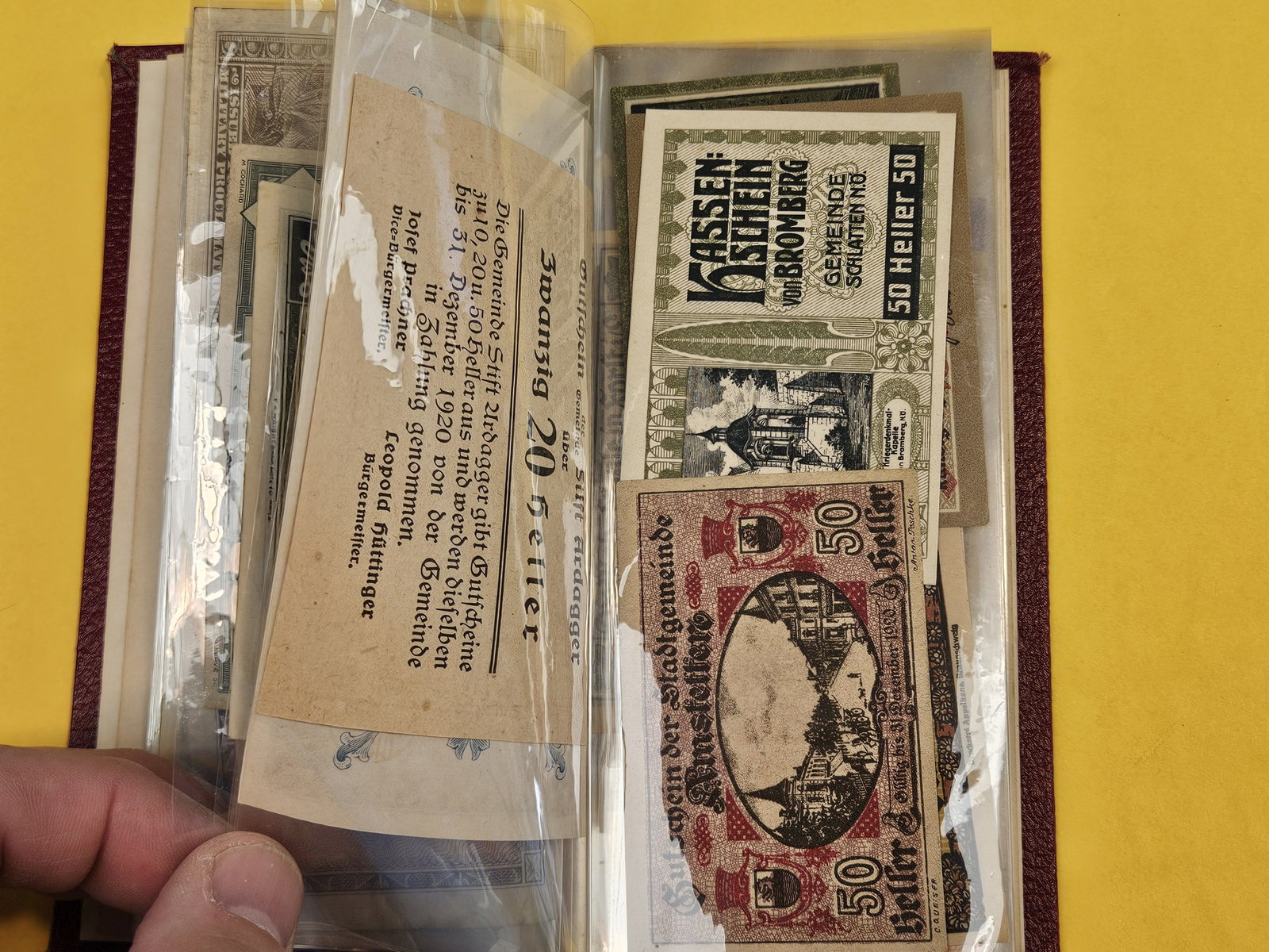 Hardcover booklet with about 40 or so pieces of World Currency - 7