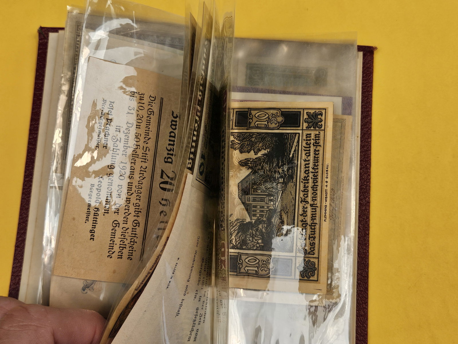 Hardcover booklet with about 40 or so pieces of World Currency - 8