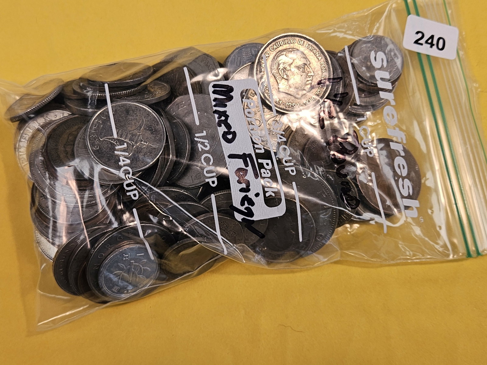 One and one-half Pounds of mixed World coins: From dealer. Unsearched by us