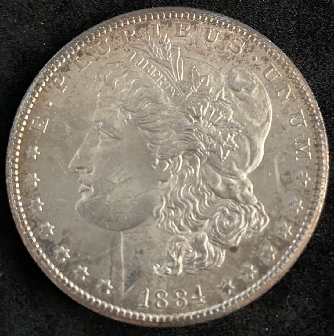 1884-CC Morgan Silver Dollar Toned (1 of 2)
