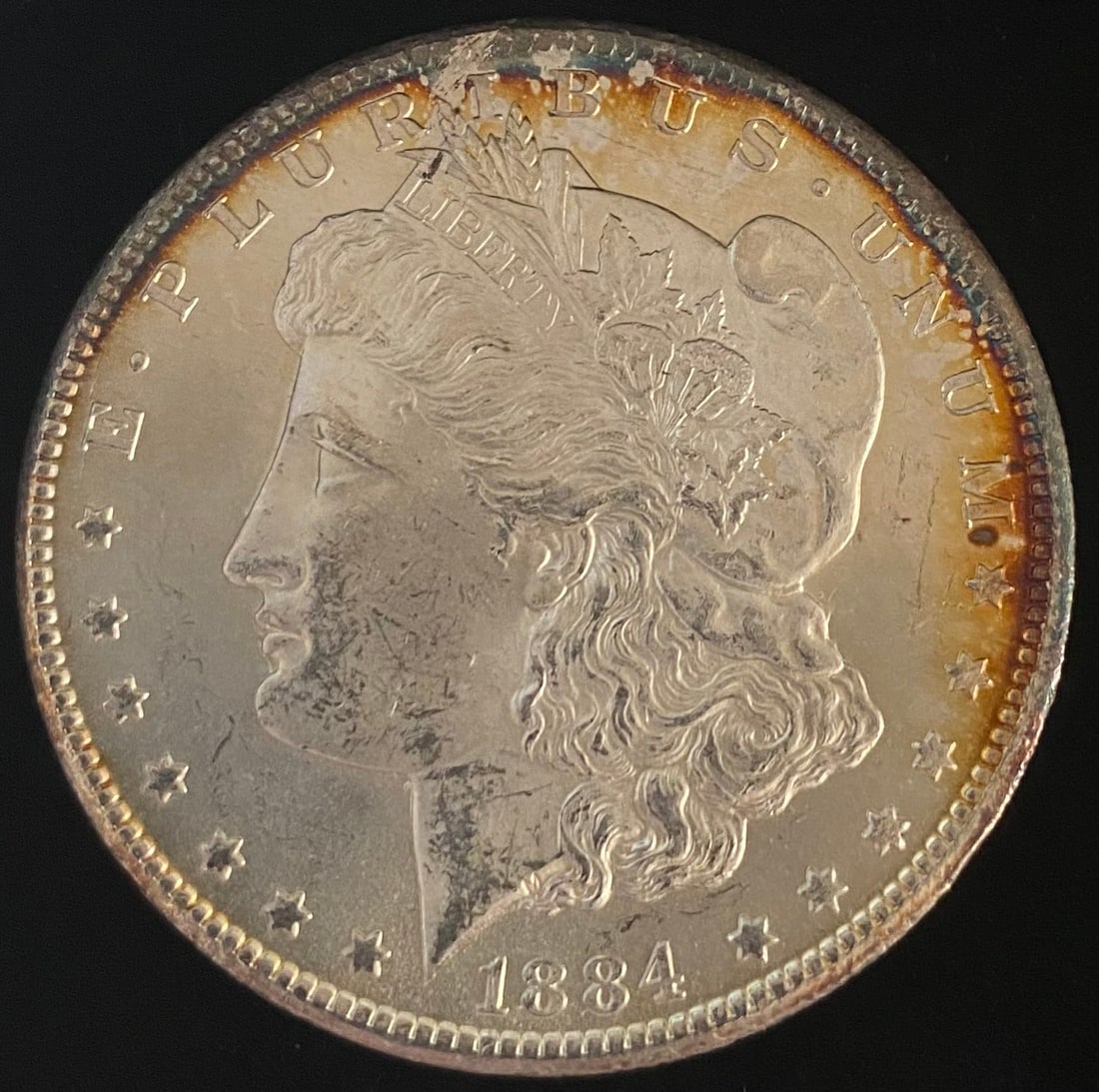 1884-CC Morgan Silver Dollar TONED (1 of 2)
