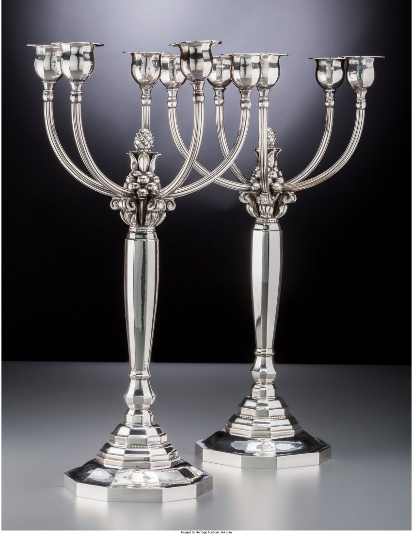 A Pair of Georg Jensen Silver Five-Light Candela: A Pair of Georg Jensen Silver Five-Light Candelabra, designed by Johan Rohde,