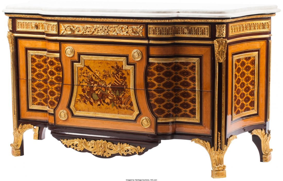 A Louis XVI-Style Gilt Bronze-Mounted Marquetry: A Louis XVI-Style Gilt Bronze-Mounted Marquetry Commode with Marble Top in the Manner of Jean-Henry Riesener</
