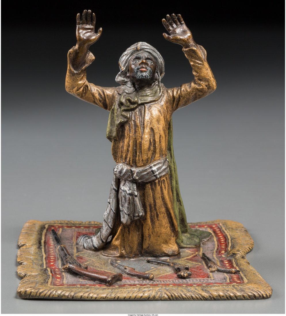 A Austrian Franz Bergman-Style Cold-Painted Bron: A Austrian Franz Bergman-Style Cold-Painted Bronze Figure: Gun Merchant Practicing Salah, 20th
