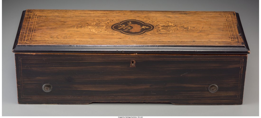 A Swiss Inlaid and Ebonized Wood Cylinder Music: A Swiss Inlaid and Ebonized Wood Cylinder Music Box, second half 19th century 5-1/8 h x 18-1/4 w x