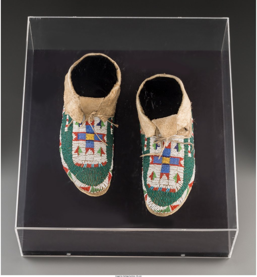 A Pair of Sioux Beaded Hide Moccasins c. 1900 : A Pair of Sioux Beaded Hide Moccasins c. 1900 hide, glass seed beads, sinew, displa