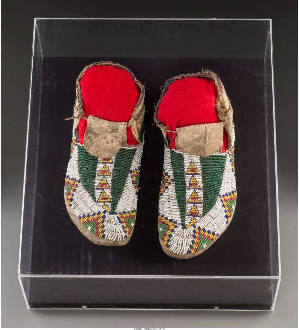 A Pair of Sioux Beaded Hide Moccasins c. 1890 : A Pair of Sioux Beaded Hide Moccasins c. 1890 hide, glass seed beads, cotton cloth,