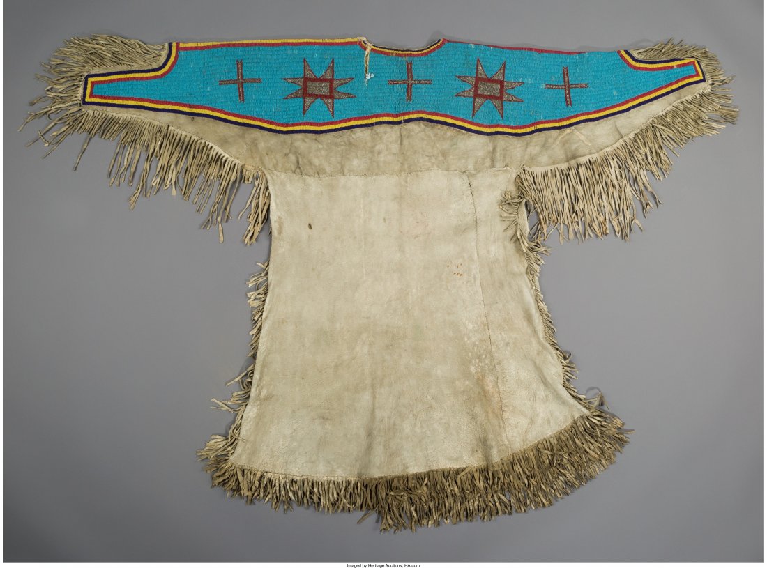 A Sioux Beaded Hide Dress c. 1900 hide, glass : A Sioux Beaded Hide Dress c. 1900 hide, glass and metal seed beads, sinew Le