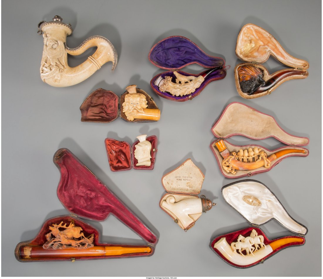 Nine Carved Meerschaum Figural Pipes, late 19th century: Nine Carved Meerschaum Figural Pipes, late 19th century 8-1/8 inches long (20.6 cm) (largest) Including pheasant atop antler, end with five heads, large curved end example engraved with crest and bear