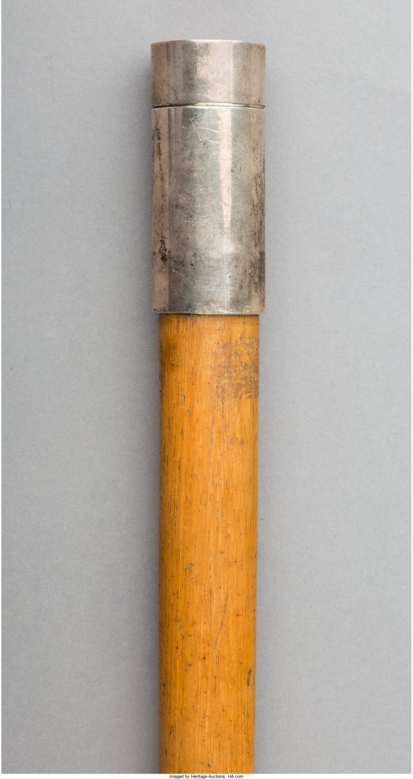 An English Silver and Oak Shaving Kit Walking Stick,: An English Silver and Oak Shaving Kit Walking Stick, circa 1905, 35-1/2 inches high (90.2 cm) Property from the Collection of Mr. Kenneth W. Davis, Fort Worth, Texas The silver fitted handle cap lifts