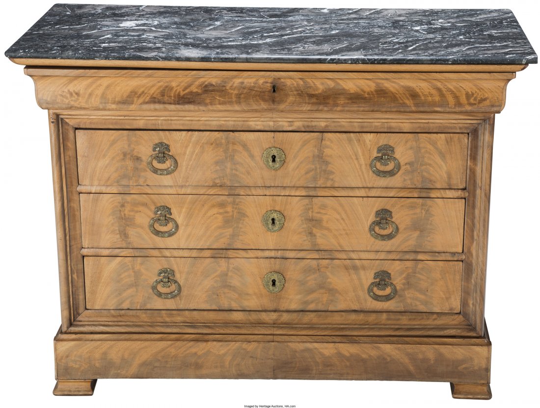 A Louis Philippe French Mahogany and Black Marble Chest: A Louis Philippe French Mahogany and Black Marble Chest with Hidden Drawer, 19th century and later 37-1/4 h x 50-1/4 w x 22-1/4 d inches (94.6 x 127.6 x 56.5 cm) Lower apron near feet extends forward