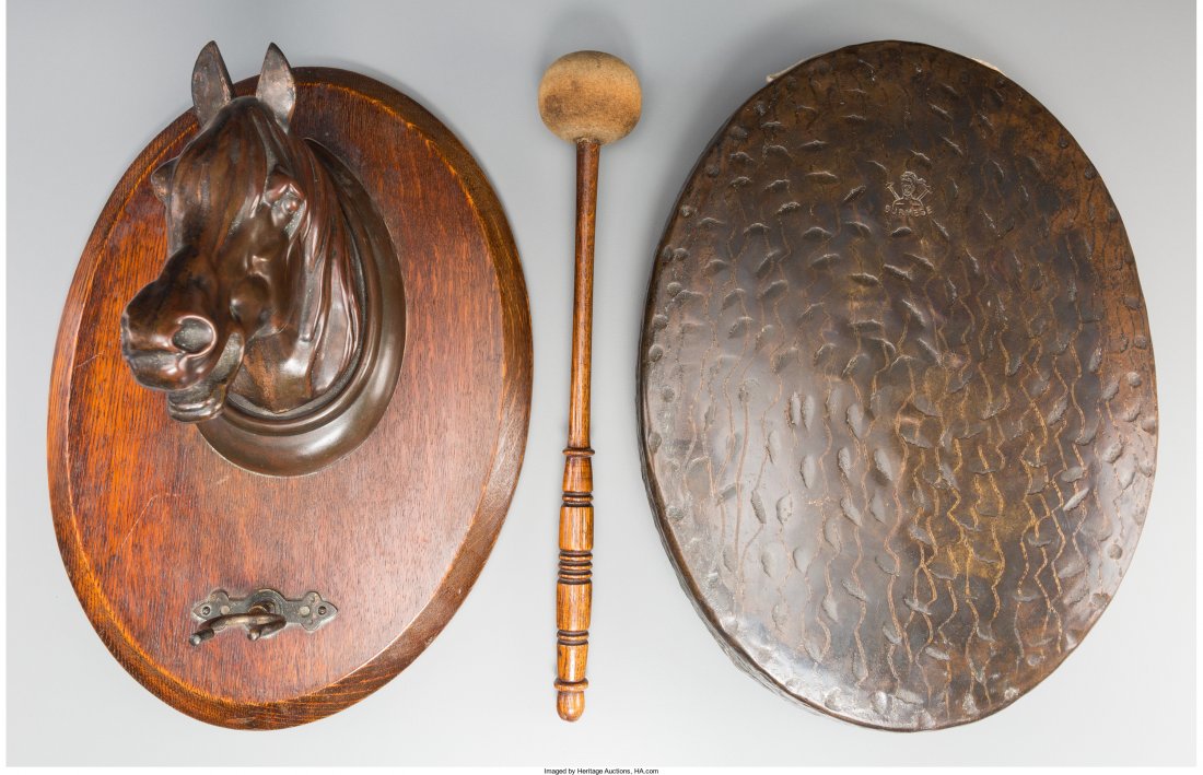 A Bronze and Oak Wall-Mounted Horse Plaque with Dinner: A Bronze and Oak Wall-Mounted Horse Plaque with Dinner Gong 14 h x 10 w x 7-1/2 d inches (35.6 x 25.4 x 19.1 cm) (plaque) Property from the Estate of Charles Schalebaum HID04901242017