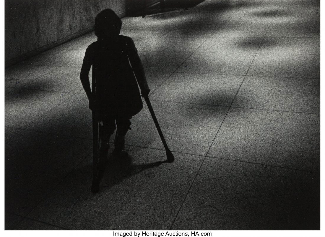 W. Eugene Smith (American, 1918-1978) Silhouette: W. Eugene Smith (American, 1918-1978)Silhouetted girl on crutches walking down hallway<