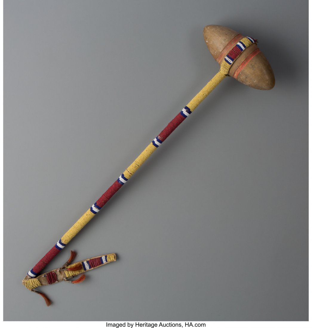 An Arapaho Beaded War Club c. 1890  wood, hide, (1 of 2)
